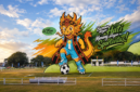 Kolaborasi gambar Maskot Piala Soeratin Cup dan lapangan GOR Samadir Maumere.