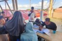 Proses pendaftaran pengungsi yang dengan sukarela ingin pulang, Minggu (23/8/2036) sore.
