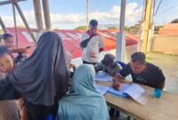 Proses pendaftaran pengungsi yang dengan sukarela ingin pulang, Minggu (23/8/2036) sore.